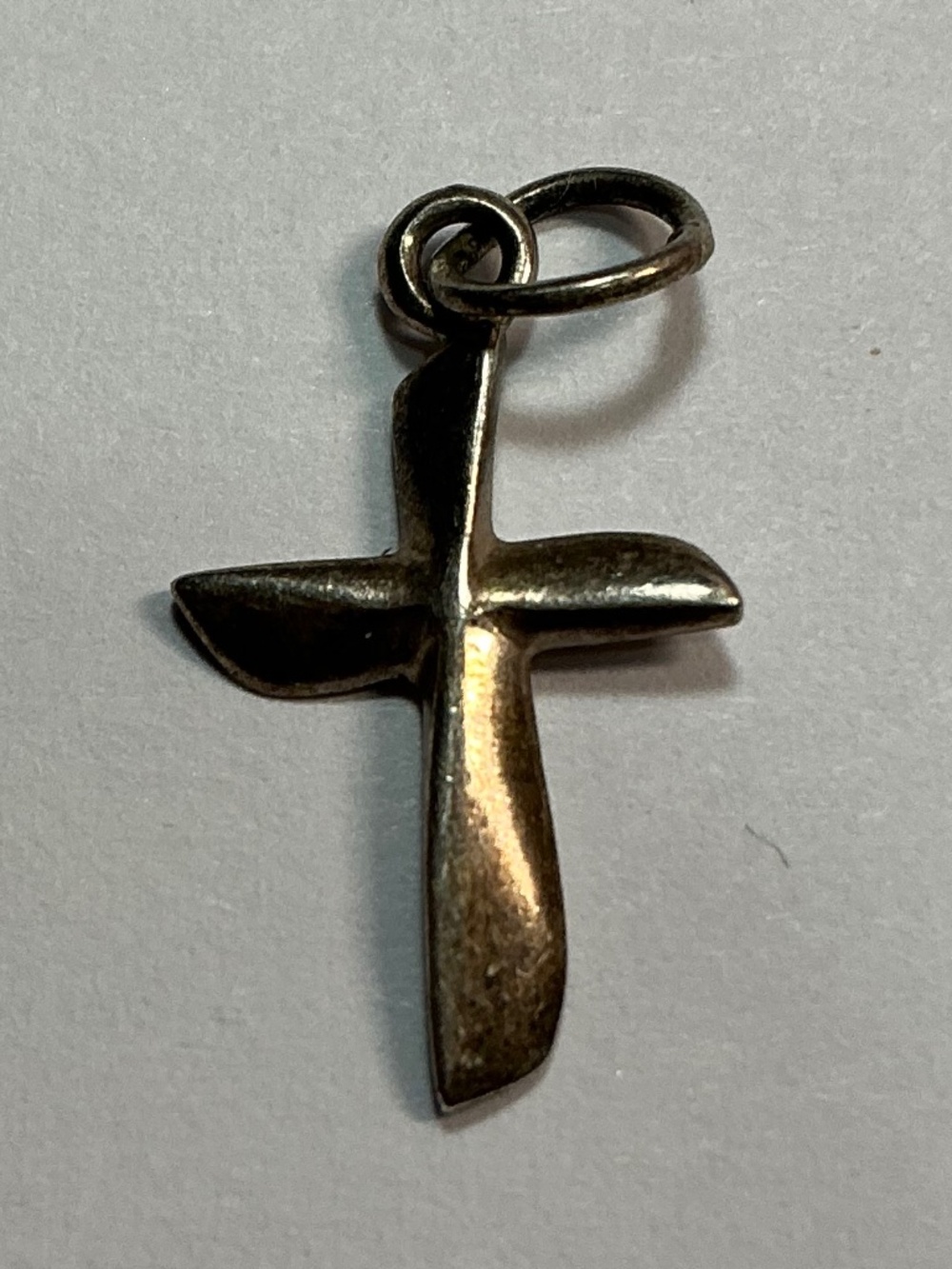 Sterling Silver Petite Cross Pendant. 3/4 inch long